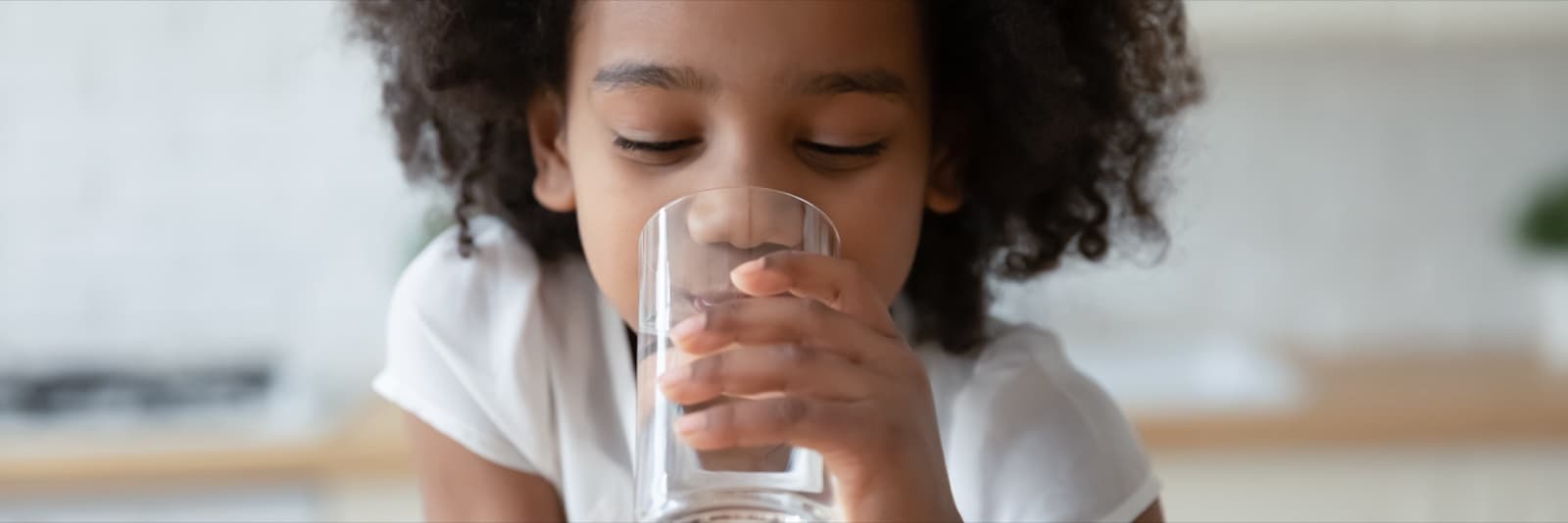 Child with clean water outdoors