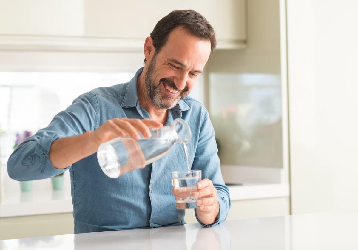 Man pouring clean water